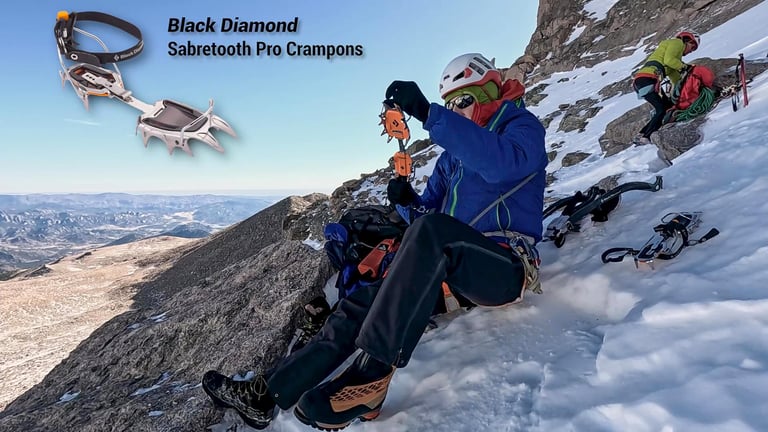 Lisa Foster putting on her Black Diamond Sabretooth Pro Crampons