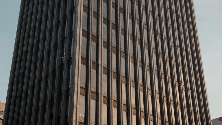 Panoramic architectural crop of a modern corporate building in São Paulo, sharp lines, cinematic evening light.
