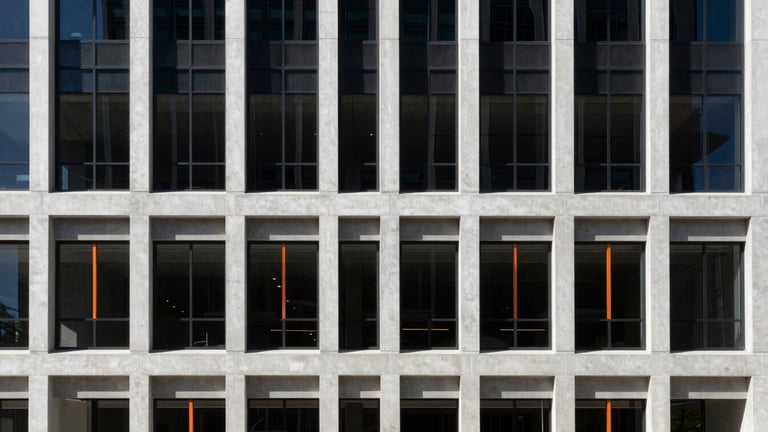 High-contrast architectural photography of a modern concrete and glass corporate center in West Jordan, sharp shadows, bright natural afternoon sunlight, minimalist composition, 35mm