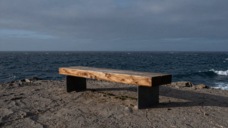 Wide panoramic view of a sculptural bench made of heavy timber and steel, placed on a rugged coastal cliff overlooking a stormy sea, moody overcast twilight, low-angle heroic shot, 35mm lens