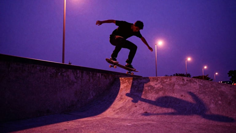 Low-angle dynamic action shot of a skateboarder performing a trick over a concrete gap at dusk, dramatic purple and magenta streetlights casting long shadows, raw concrete textures, 35mm film grain, dark purple overlay.
