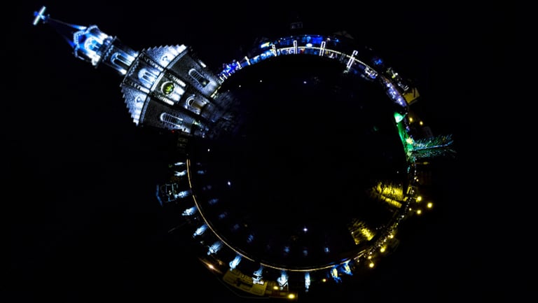 a circular shaped object with a clock tower in the background