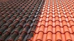 a roof with a red tile roof and a blue sky