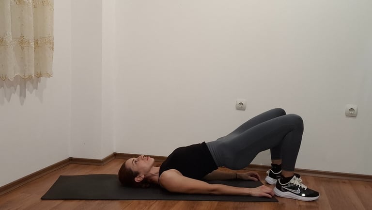 a woman is doing a yoga pose on a mat