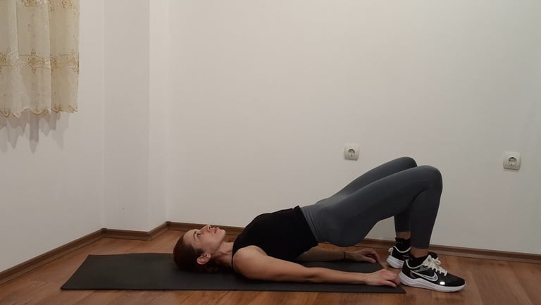 a woman is doing a yoga pose on a mat