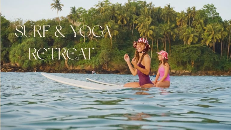 girls sat on surfboards at tropical beach