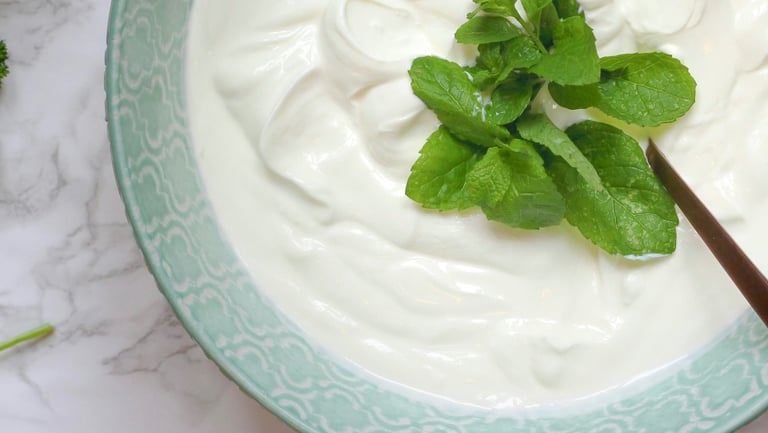 bowl of natural yoghurt with mint