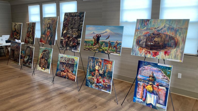 Collection of original oil paintings by Meruzhan Khachatryan displayed on easels in an exhibition st