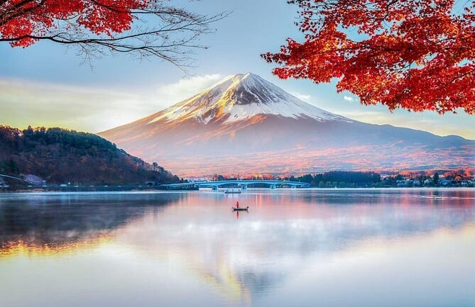 Lake with automn red leaves and Mount Fuji with bark