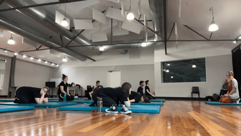 a group of people in a gym room