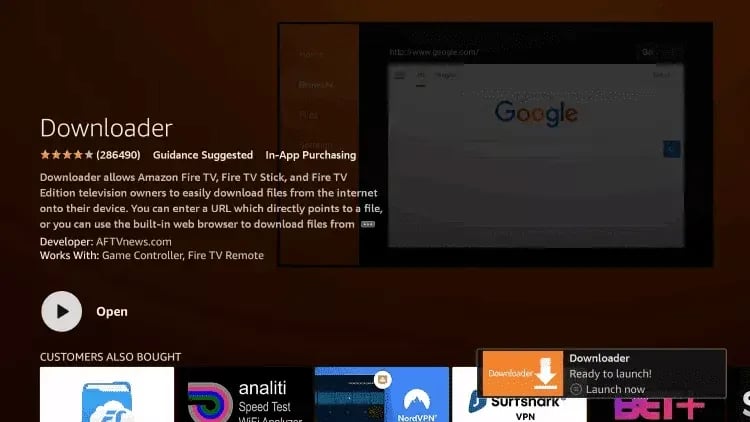 Amazon Fire TV app store interface displaying the Downloader app description and installation notification.
