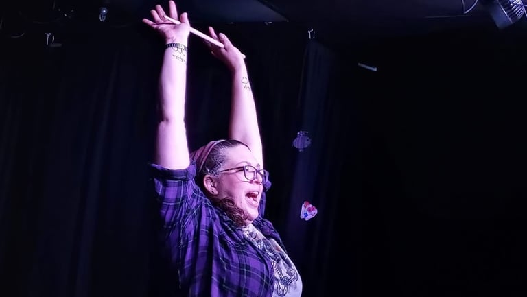 Hands up drumming on stage