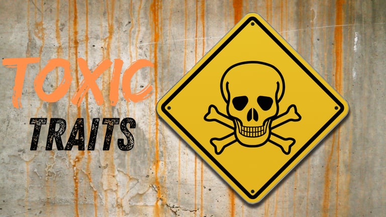 A yellow skull and crossbones hazard sign on a stained wall with the text Toxic Traits.