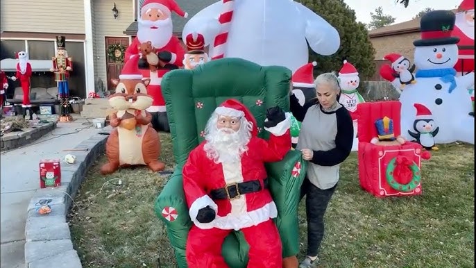 Woman setting up inflatable Christmas displays