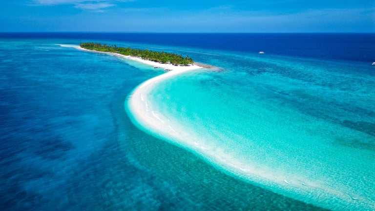 a small island with a small island in the middle of the ocean