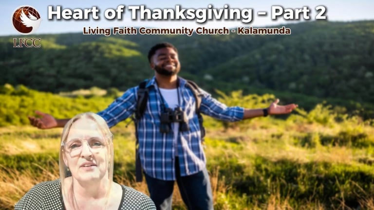 A man stands with arms wide in a field for the Heart of Thanksgiving sermon at Living Faith Community Church.