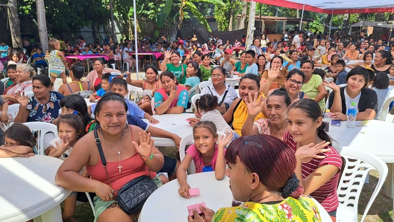 A large community gathering of families  at a Mother's Day Event organized by Roger Bardales