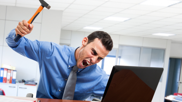 Frustrated man at computer