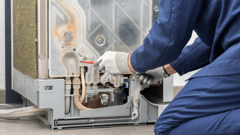 a person in a blue uniform is holding a wrench