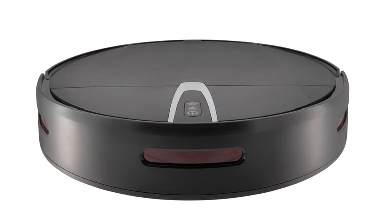 a robot vacuum cleaner with a black and white background