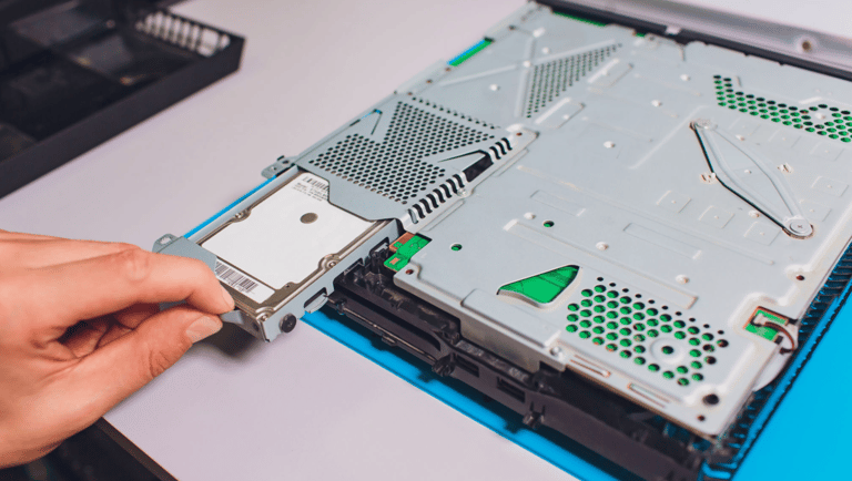 a person is holding a piece of a hard drive