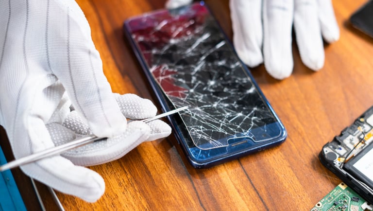 a person in gloves holding a pair of gloves and a pair of gloves