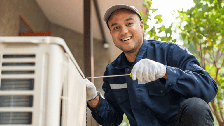 a man in a blue shirt and gloves is holding a wren and wren