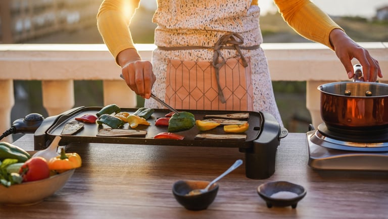 a woman in a white apron is cooking on a grill