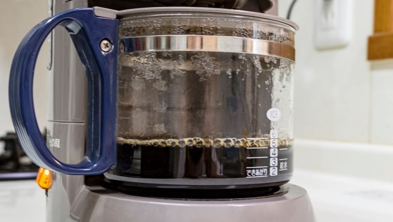 a coffee maker with a coffee potted in a coffee pot