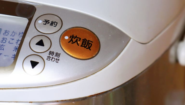 a close up of a button on a coffee maker
