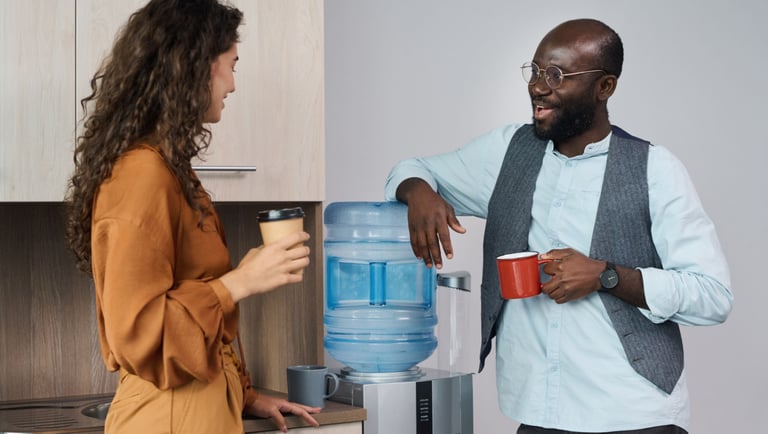 a man and woman standing in a kitchen