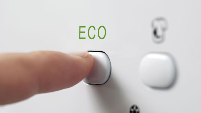 a finger pressing the word eco on a button