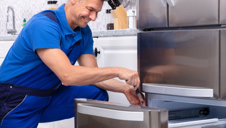 a man in a blue shirt and blue overalls and a blue shirt