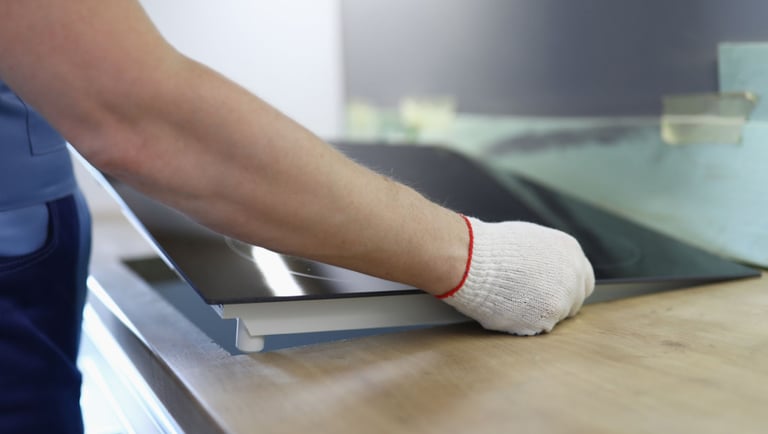 a person wearing gloves and gloves is cleaning a counter top