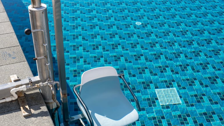 a chair that is sitting in front of a pool