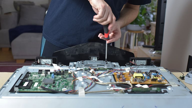 a man is holding a pair of scissors and a pair of scissors
