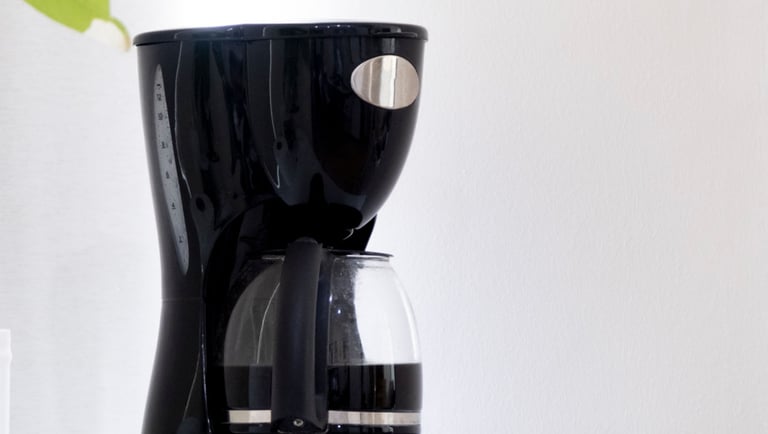 a coffee maker with a glass coffee maker