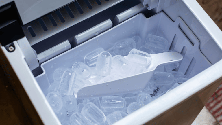 a plastic container filled with ice and a spoon