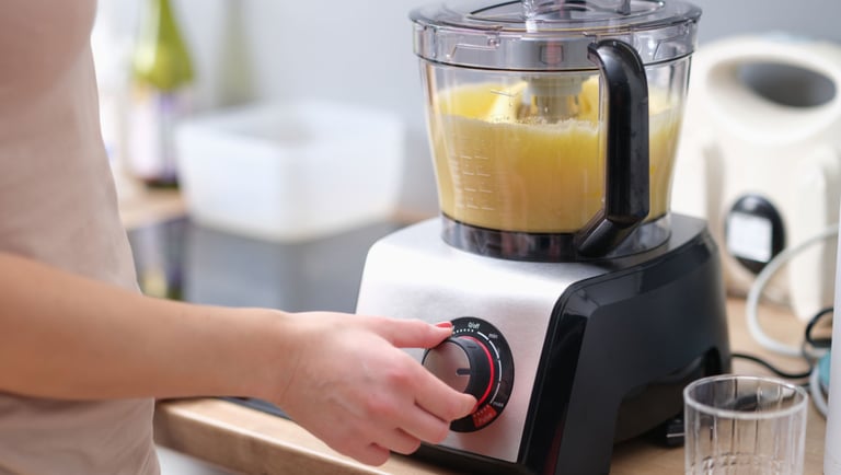 a person is making a juicer in a blender