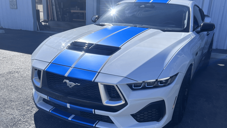 Satin black vinyl wrap finish on vehicle