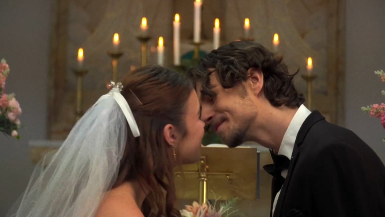 a man and woman kissing in a church
