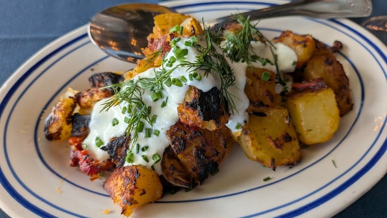 potatoes topped with sauce