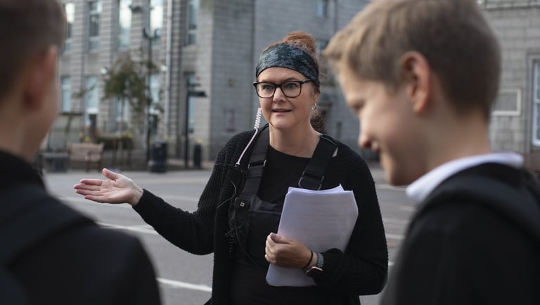 Film studio production company manager wearing a black jacket