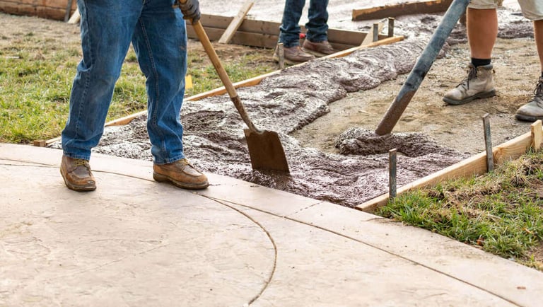 Concrete Contractors working on concrete walkway in Warner Robins, GA