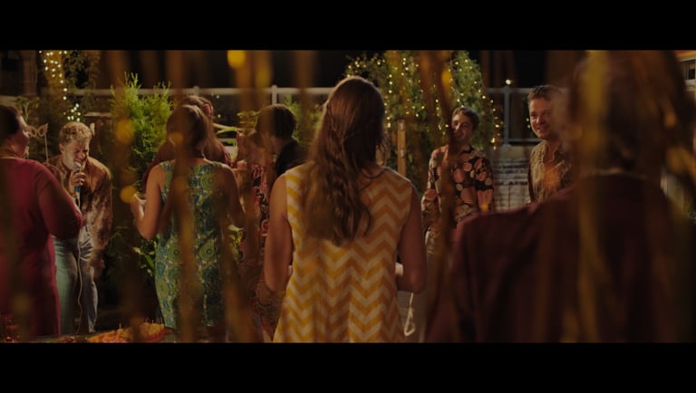 a group of people standing around a table