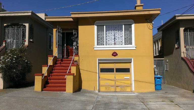 Vents and mail slot on garage door in San Francisco.