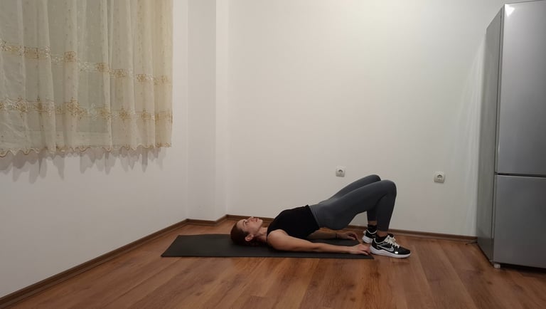 a woman is doing a yoga pose on a mat