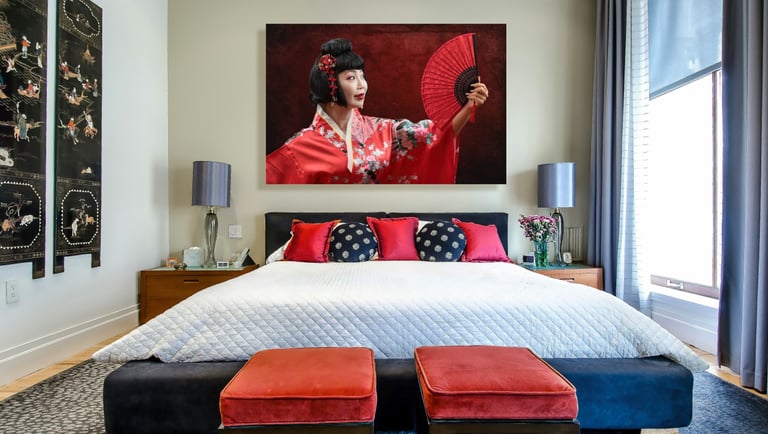 a bedroom with a large painting of a woman in a kimono