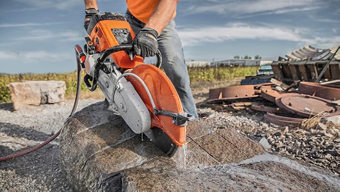 Using a cut off machine to cut stone