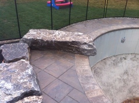 a backyard pool with a swing set and a swing set